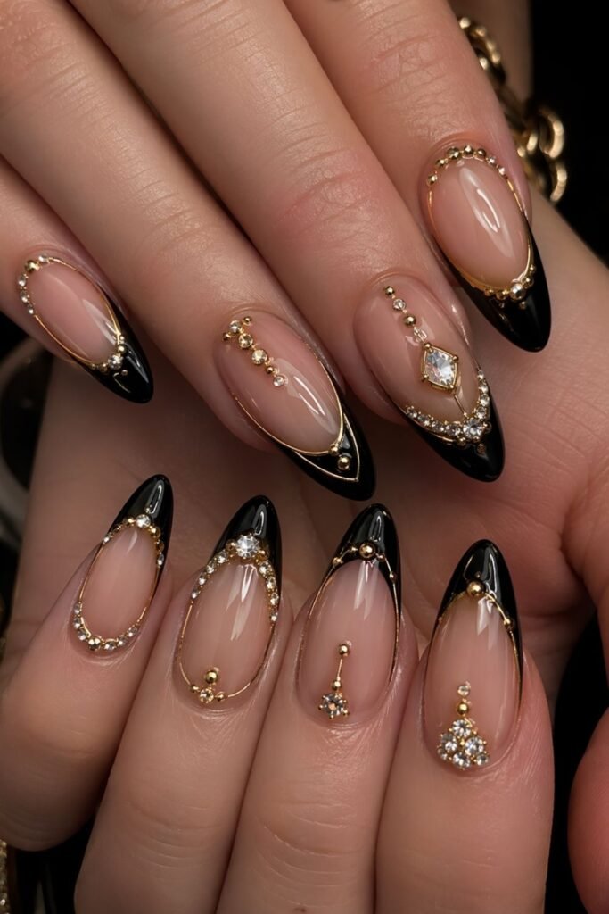 luxury black french tip almond nails with gold accents