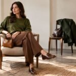 Stylish olive green and brown outfit with tailored trousers and leather accessories